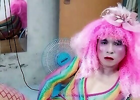 Transgender Le wears sexy clothes and plays cups of sex. Artificial cans